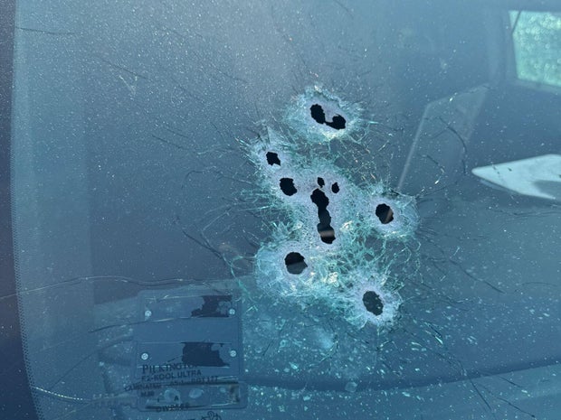 A picture released by the Polk County Sheriff's Office in Florida shows what appears to be bullet holes in a patrol vehicle after sheriff's deputies shot a man in the vehicle, May 26, 2025. 